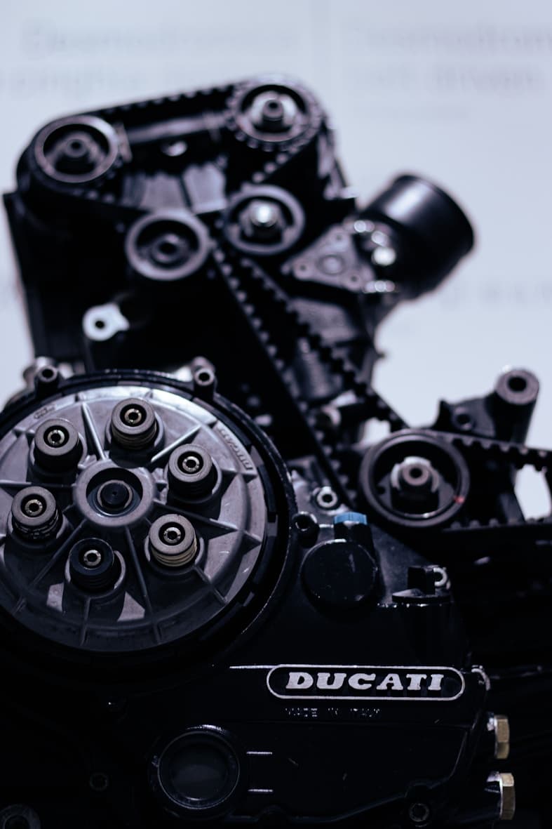 AC compressor being serviced in automotive workshop