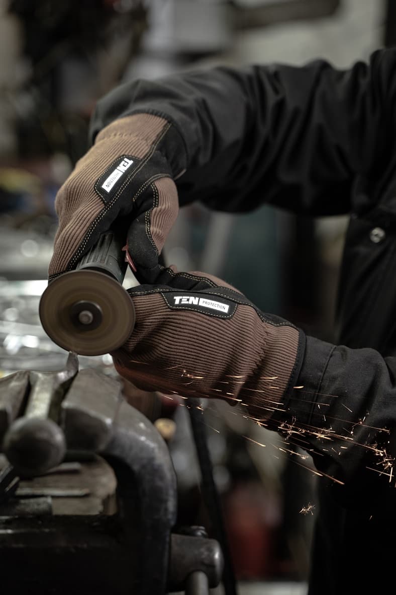 Fuel injector being serviced by automotive technician